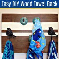 I LOVE this quick and easy home decor project! Here's How to Make a Pretty and Easy DIY Wood Towel Rack any size, to match any room. Make a wall mounted towel holder.