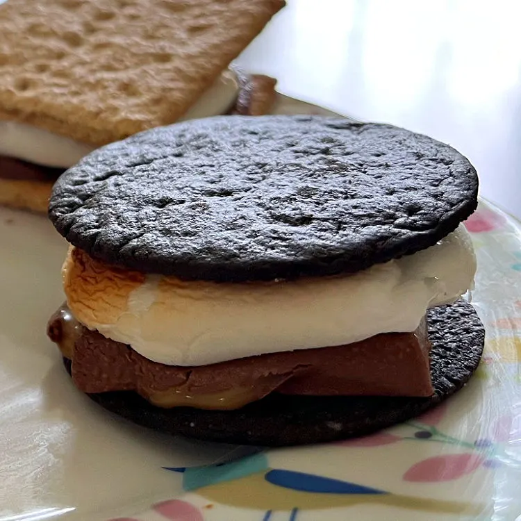 Image shows Ghirardelli Caramel Squares on Chocolate Wafers with marshmallows to make Smores.