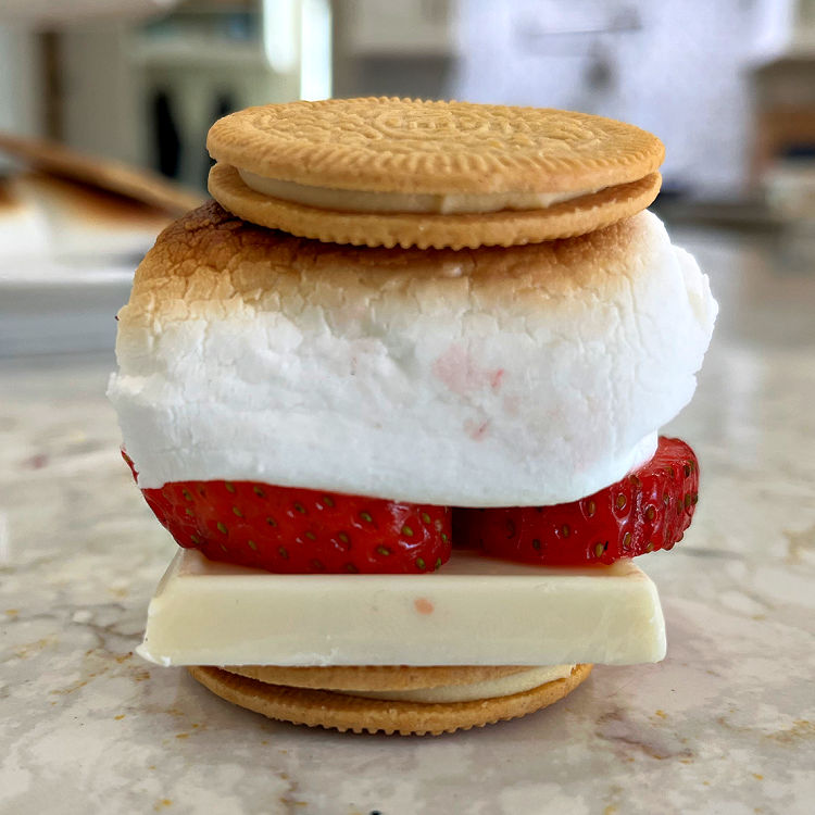 Image of Lemon Oreo Thins, white chocolate, and fresh strawberries on Lemon Oreo Thins Smores.