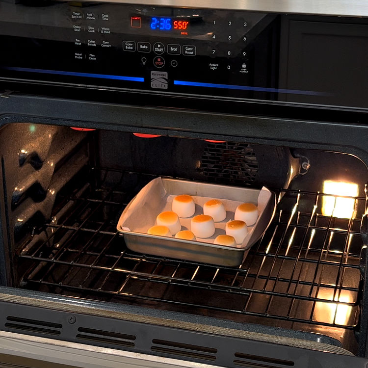 Image shows marshmallows roasting in an oven to make Smores.