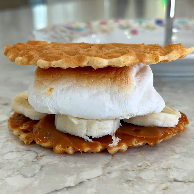 Image of Dulce De Leche, bananas, and marshmallow on a waffle cookie Smores.