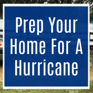 Image of a flooded driveway during a hurricane with text over it that says "Prep your home for a hurricane".