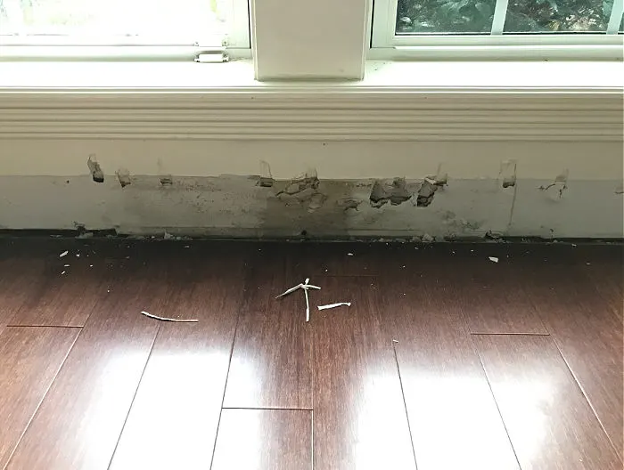 Image of water damage under a window.