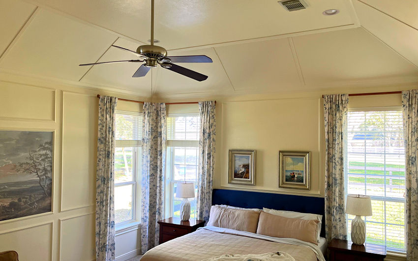 Trim and crown molding on vaulted ceiling with a tray (flat) top.