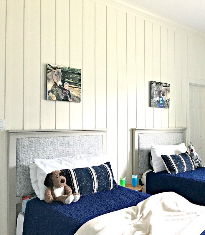 This beautiful DIY Board and Batten Wainscoting has completely updated this bedroom with a new high end designer look. And it was pretty easy. See the full tutorial and DIY tips here. #AbbottsAtHome #Wainscoting #DIYProjects #HomeRemodeling