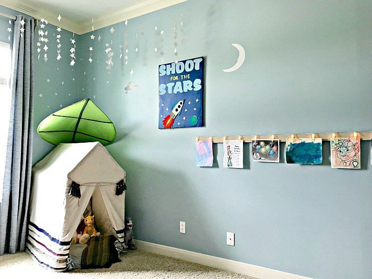 It's time for the boys bedroom makeover reveal, guys! And I'm so excited to share it with you. The whole room is full of awesome DIY projects, affordable decor, and fun boys bedroom ideas. I'm loving it and so are my boy's! This is a blue, white, and grey bedroom full of pops of fun colors. I think it's a bit Farmhouse, a bit traditional, and a bit Land of Nod. I designed this for my boys, but most of the ideas would work for all kids, boys and girls. #kidsbedroom #kidsroom #boysbedroom #bedroomideas