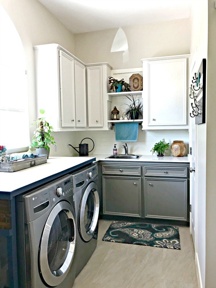 After makeover photos on a white and grey Laundry Room with Teal accents and lots of budget-friendly DIY. This post is full of Before & After Makeover Photos, budget-friendly DIY ideas, and Laundry Room decor. #LaundryRoom #BeforeandAfter #AbbottsAtHome