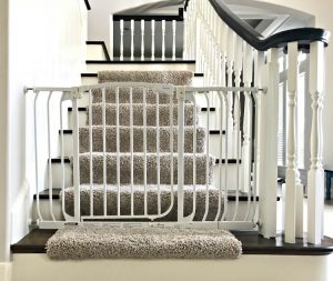 Here's a cheap and easy DIY that I have loved for 4 years. It's my DIY Baby Gate Hack for Stairs. And, this thing is sturdy. My boys have both stood at that gate and shook it back and forth. And it did not budge at all. Yaasss! Here's my tutorial for how to make this baby gate work for stairways and banisters. Works with wide openings too. #AbbottsAtHome #Stairways #BabyGate #Babyproof #BabySafety #HomeDIY #HomeSafety