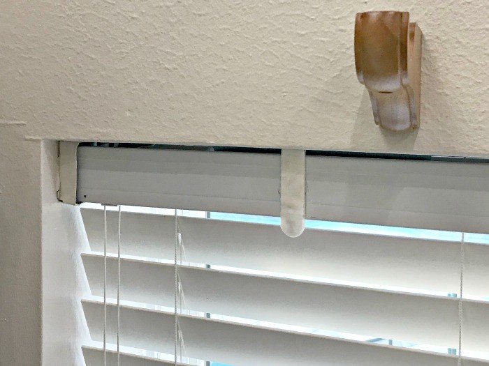 Here's a Quick and Easy DIY Fix for Broken or Lost Valance Clips, you can do in 5 minutes! Repair those wood or vinyl blinds valance clips with my favorite DIY hack product. #DIYHack #DIYProject #HomeImprovement #Blinds #AbbottsAtHome