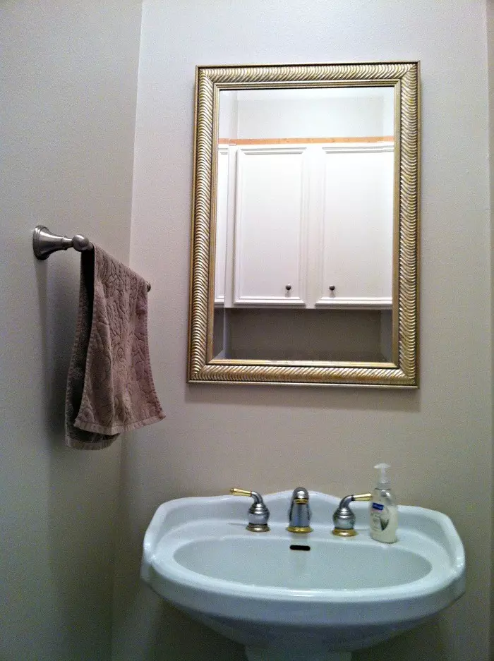 Before photo on a boring water closet with a pedestal sink.
