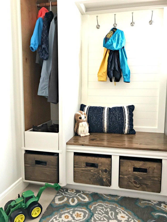 Love this DIY! Here are the cheap and doable DIY projects I used when I Added a Mudroom to our Laundry Room. #LaundryRoom #Mudroom #HomeRemodel #MudroomBench #AbbottsAtHome