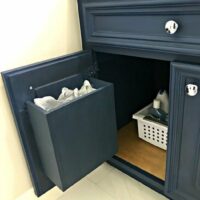How to make built in cabinet garbage cans in a bathroom or kitchen. See the easy DIY Steps and build pictures. #AbbottsAtHome #BathroomReno #BathroomRemodel #GarbageCan #GarbageIdeas #OrganizationIdeas