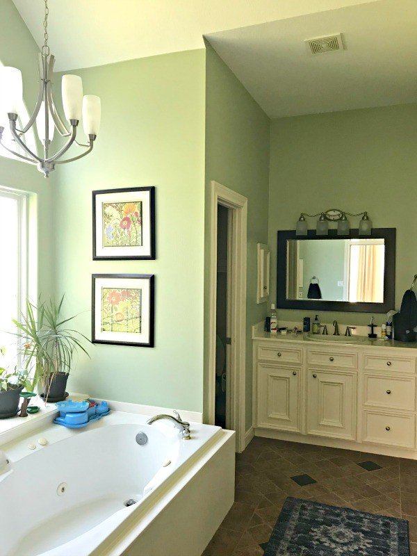 Here's a look at our Master Bathroom before the big makeover. It has 2 vanities, a big roman tub in front of a bay window and a walk in shower.