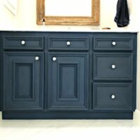 This DIY Napoleonic Blue Bathroom Vanity Makeover has completely transformed my bathroom. The color is beautiful and chalk paint is a great low budget diy project that anyone can do. #AbbottsAtHome #ChalkPaintMakeover #BathroomCabinets #BathroomVanity