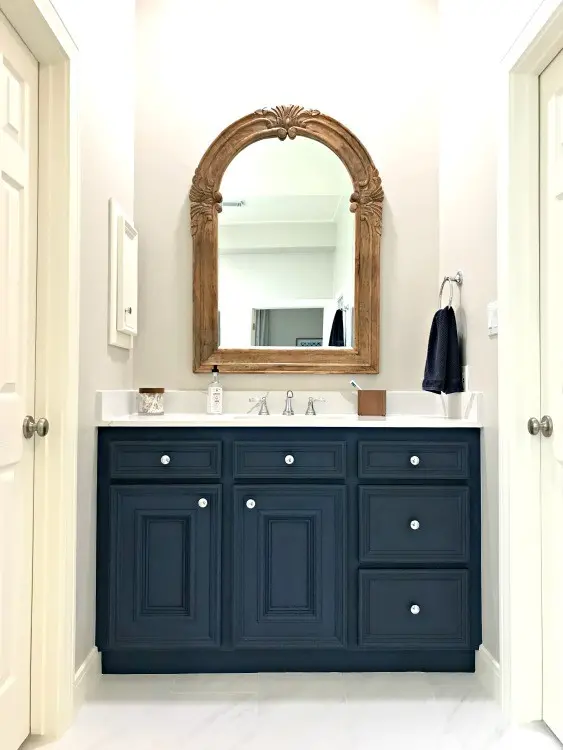 This DIY Napoleonic Blue Bathroom Vanity Makeover has completely transformed my bathroom. The color is beautiful and chalk paint is a great low budget diy project that anyone can do. #AbbottsAtHome #ChalkPaintMakeover #BathroomCabinets #BathroomVanity #BathroomRemodel