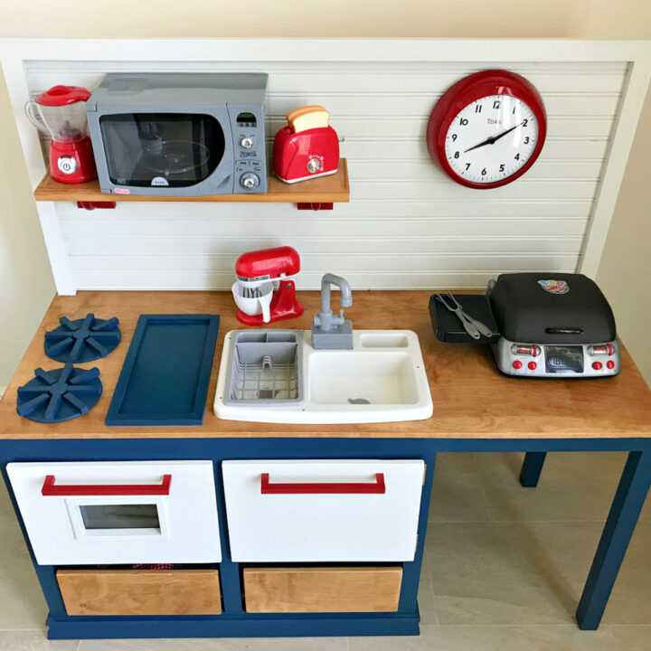 Top down look at the kids play kitchen with a sink and oven.