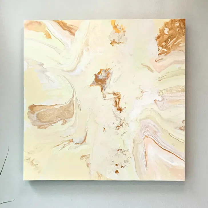 Image of one way to paint over an old canvas - with a DIY paint pour.