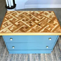 Image of a DIY mosaic wood table top on furniture. In s post about this table top design idea.
