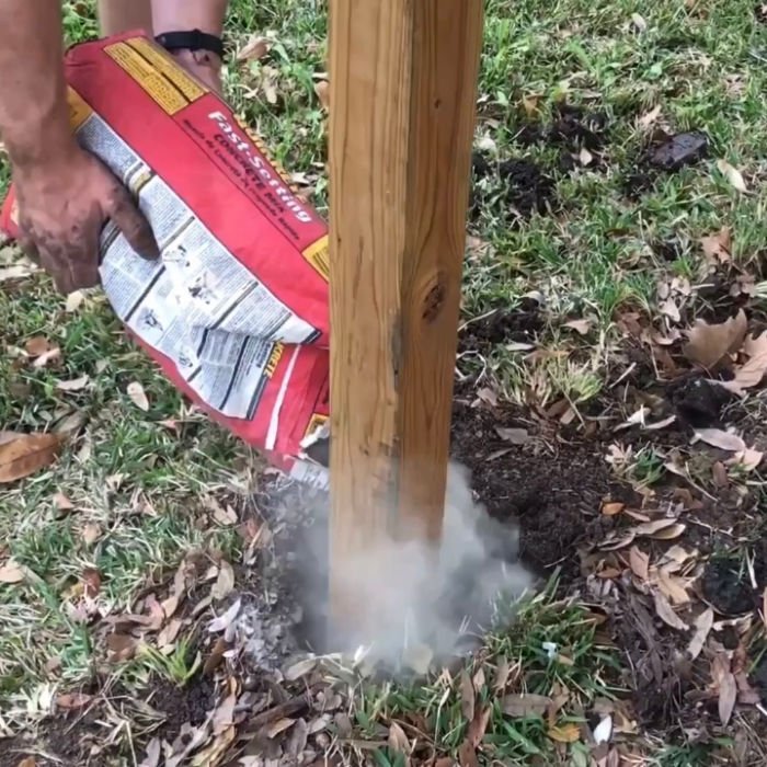 Here's how to set wooden fence posts in concrete - with written steps and a quick video to show you how to build or DIY your own Three Rail Fence or other horizontal fence ideas.