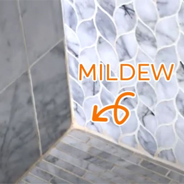 Easy to follow DIY steps for How to Clean Marble Shower Tile, safely get rid of that gross pink mold and mildew, and seal your marble. With How-To Video and DIY Marble Tile Cleaning Steps.