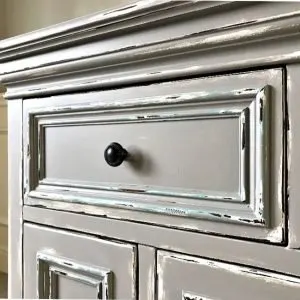 Here's my easy to follow steps for this beautiful DIY Gray Chalk Paint Furniture Makeover. With this tutorial you can distress as little or as much as you want to get the look you love. Paint layering and distressing with written steps and how to video.