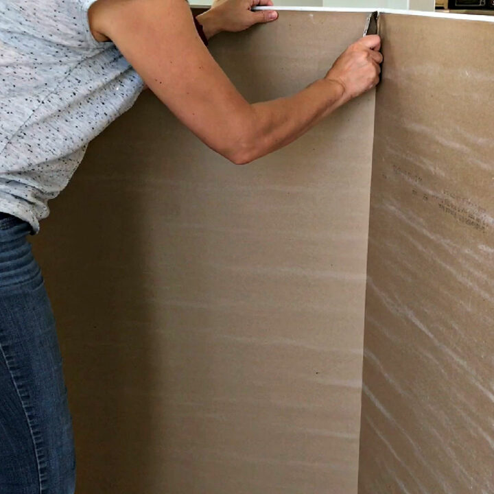 Image of someone cutting drywall for Beginner Tips to Cut Drywall and Hang Drywall - Install Drywall for beginners.