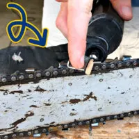 Image of a Dremel Sharpening Kit being used to sharpen a chainsaw chain (or chainsaw blade).