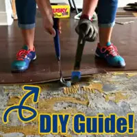 Image of someone using a pry bar to remove glued down engineered wood flooring, for a DIY Guide for ways to remove glued down floors and removing glue on concrete.