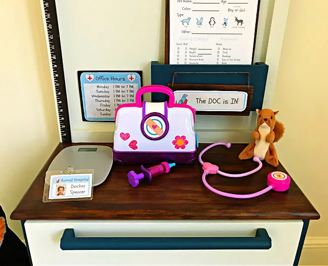 Make your kids this sweet little DIY Kids Play Pet Vet Clinic with this easy to follow beginner woodworking build plan. This DIY Kids Play Pet Hospital has been a popular playset with our little veterinarians, this year. Printable Pet Clinic Signs, Patient Forms, and Build Plans Available.