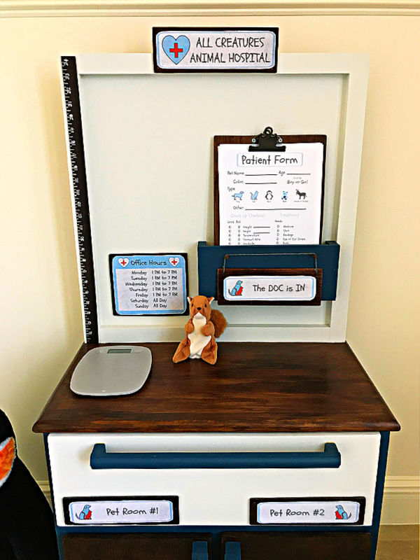 Make your kids this sweet little DIY Play Animal Doctor Office with this easy to follow beginner woodworking build plan. This DIY Kids Play Pet Hospital has been a popular playset with our little veterinarians, this year. Printable Pet Clinic Signs, Patient Forms, and Build Plans Available.
