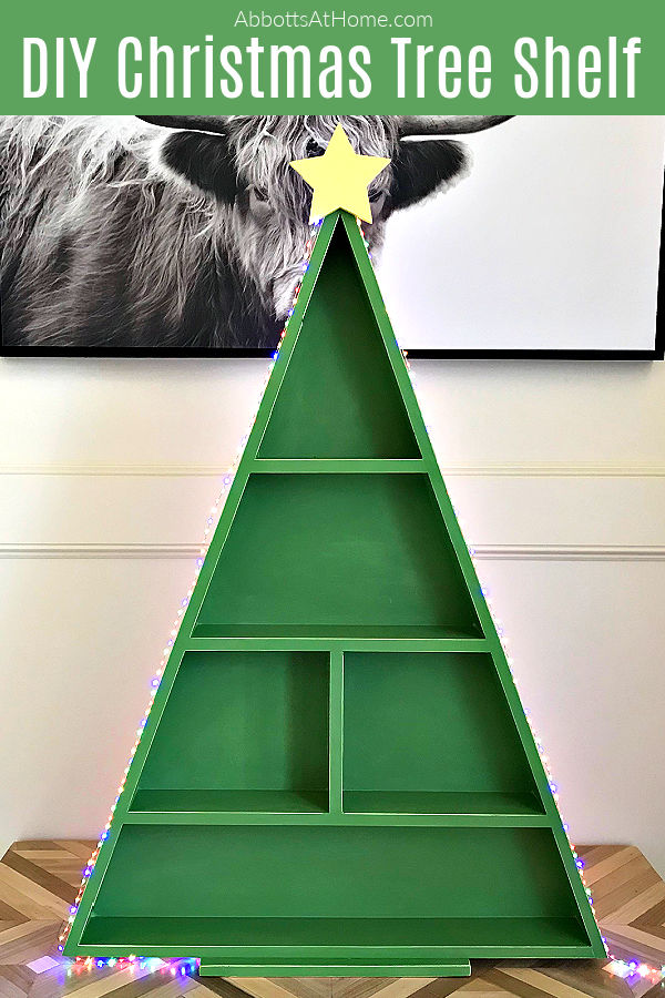 Easy woodworking steps & video for this big table top or floor-sized DIY Wood Christmas Tree Shelf. Printable woodworking plans, easy enough for beginner woodworkers. I'm loving this fun way to display all of my favorite Christmas decorations. This DIY Wood Christmas Tree Shelf is a great display for Cookies & Cocoa Bars, Christmas Villages, Advent Calendars, Christmas Ornaments and more.