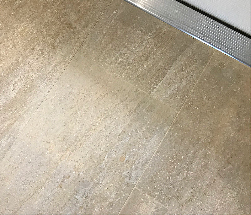 Image is an example from a Before and After Grout Renew Review post.