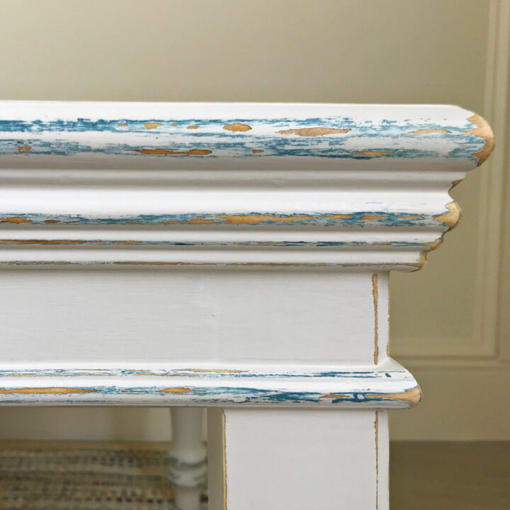I LOVE this easy DIY White and Blue Distressed Chalk Paint Look. Here's the easy to follow steps and how to video to help you paint this look. A little bit of distressing on the furniture curves & corners adds so much character!