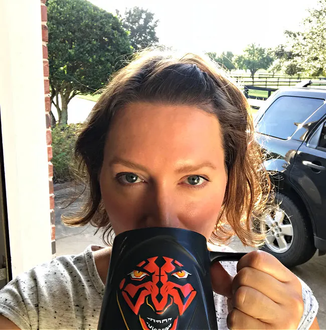 Photo of a woman drinking from a Darth Maul mug. Taken on my 43rd birthday.