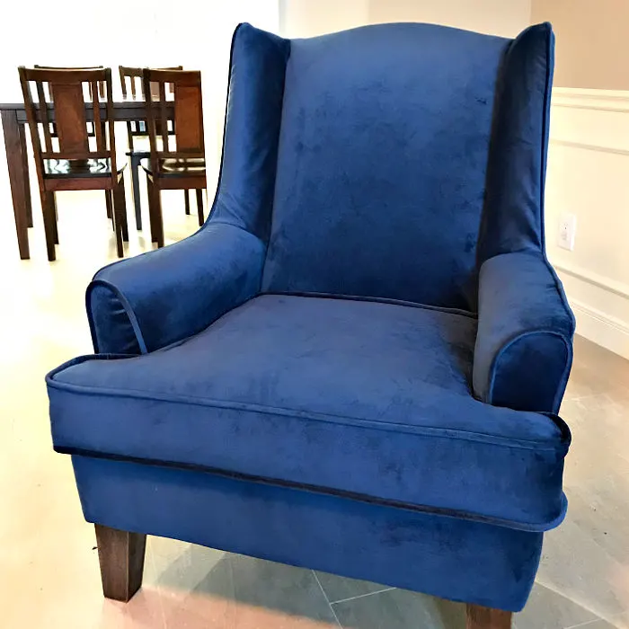 The best tips and tutorials to reupholster a wingback chair, with tons of pictures. I'm LOVING this blue velvet fabric on this chair, guys!