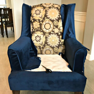 The best tips and tutorials to reupholster a wingback chair, with tons of pictures. I'm LOVING this blue velvet fabric on this chair, guys!
