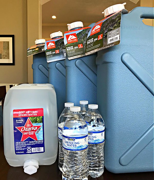 Image of large emergency water storage containers and small water bottles.
