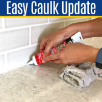 Image of someone caulking a kitchen counter top for a post with Easy DIY Steps & Video for How to Caulk A Kitchen Counter.