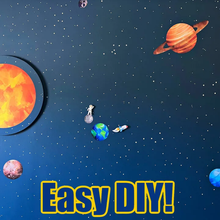 Image of an Easy Outer Space Themed Boys Bedroom Wall using vinyl stickers for planets and glow in the dark stickers for stars. Text says "Easy DIY".