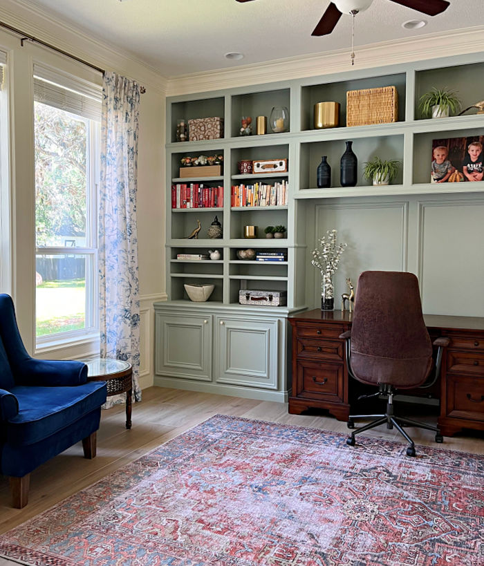 Home office makeover reveal picture with green office storage and cabinets.