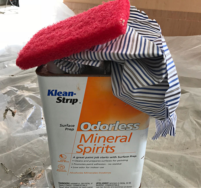 Image of Odorless Mineral Spirits, a rag, and a paint stripping pad.