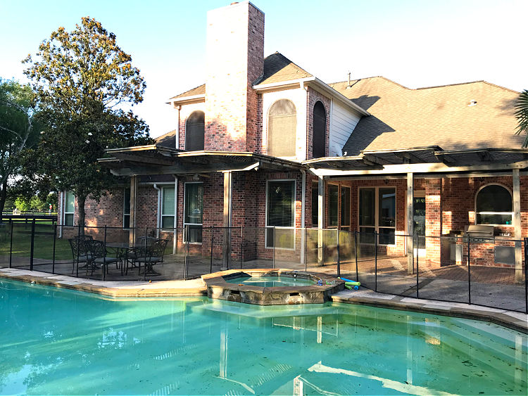 Backyard pool on a brickhouse.