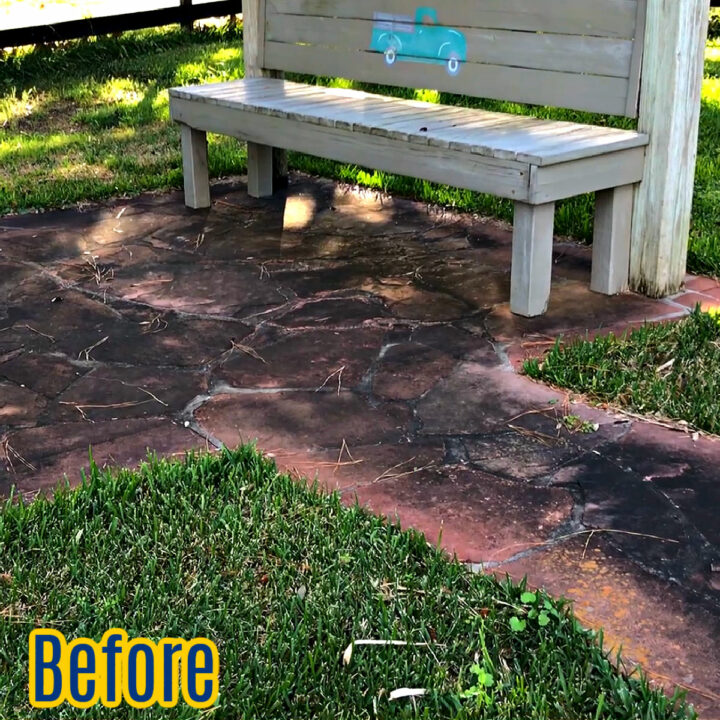 A stone walkway covered in dirt and mildew before pressure washing.