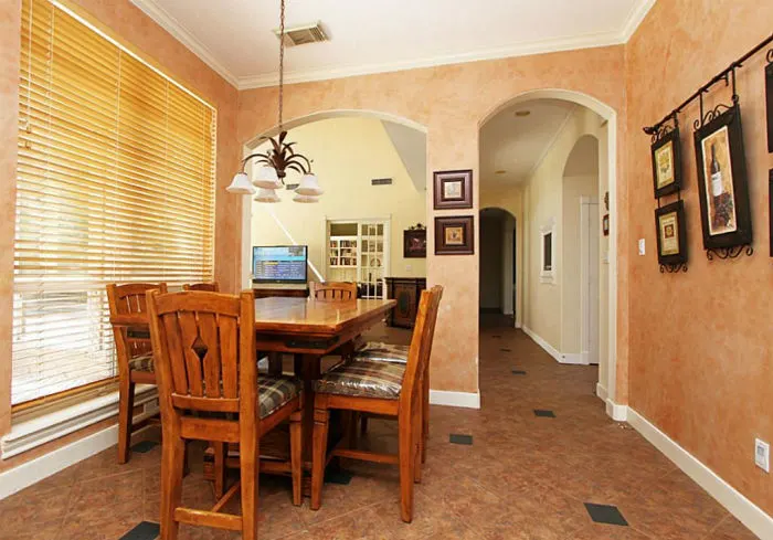 Image of a 90's style breakfast nook in a large kitchen.