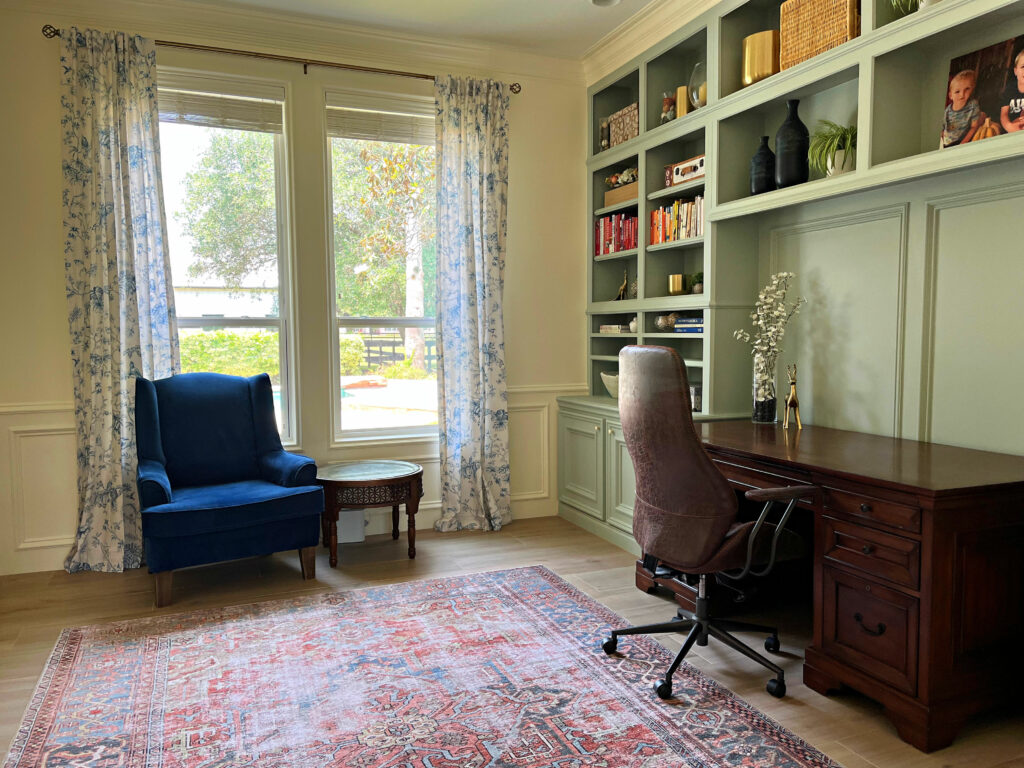 Home office with lots of natural daylight, big windows, and white walls.