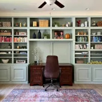 Image of a nicely decorated home office. In a post with 21 best ways to make a home office look better on a budget.