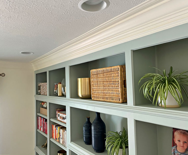 Image of layered crown molding on built in cabinet storage in an office.