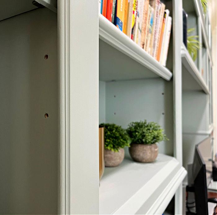 Image of detail trim lining the inside of the face frame on open cabinets or bookshelves.