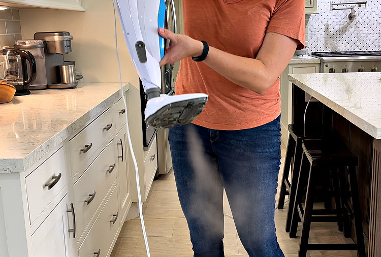 Image of a steam coming out of a light steam mop.