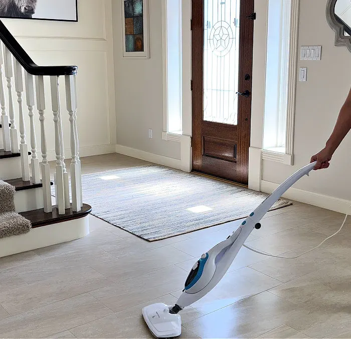 Cleaning a tile floor and grout with a PurSteam steam mop.